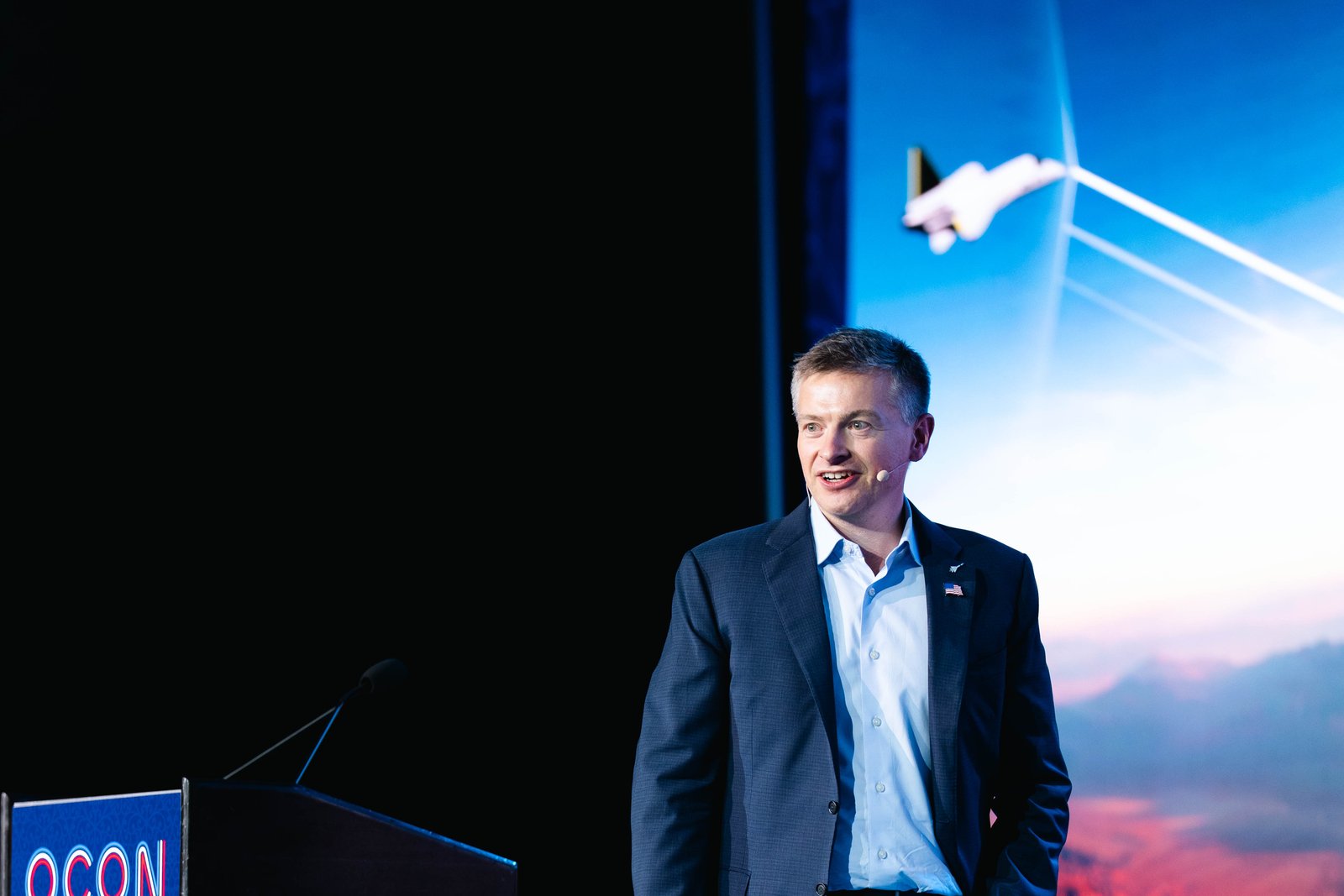 A speaker presenting at an Objectivist business conference